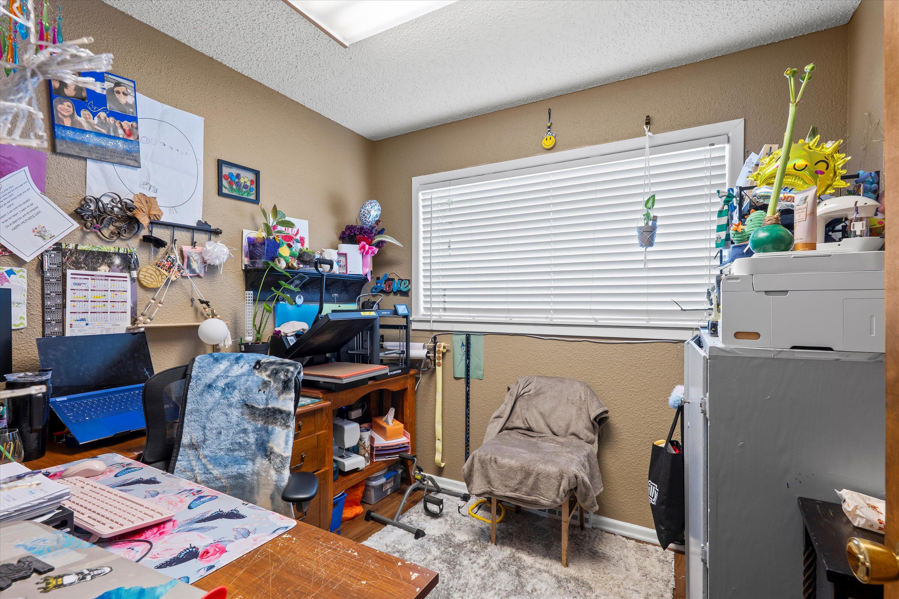 403 Crescent Drive Littlefield, TX 79339 - Photo 19 of 35 a bed room with a bed and a couch