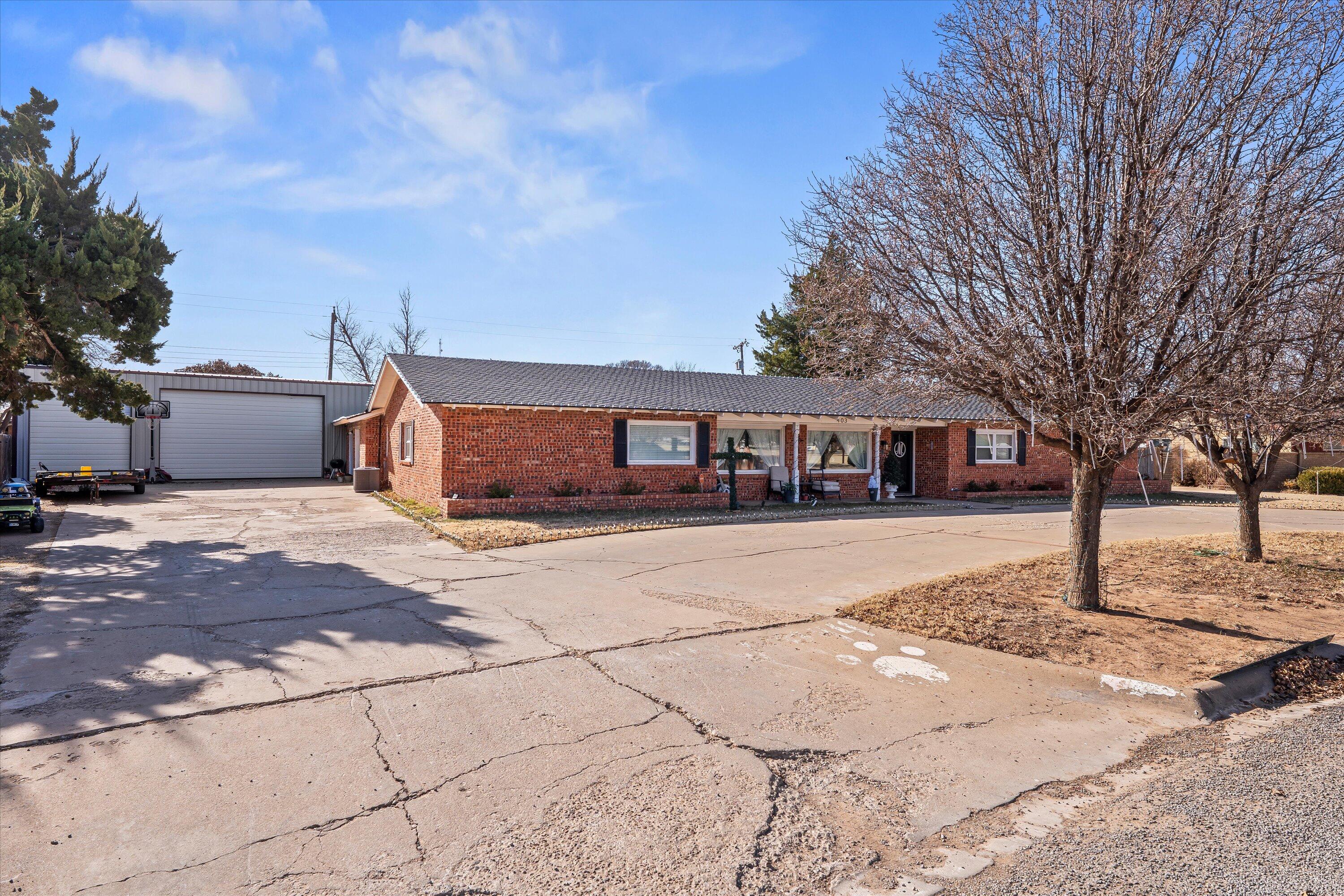 403 Crescent Drive Littlefield, TX 79339 - Photo 2 of 35 a front view of a house with a yard