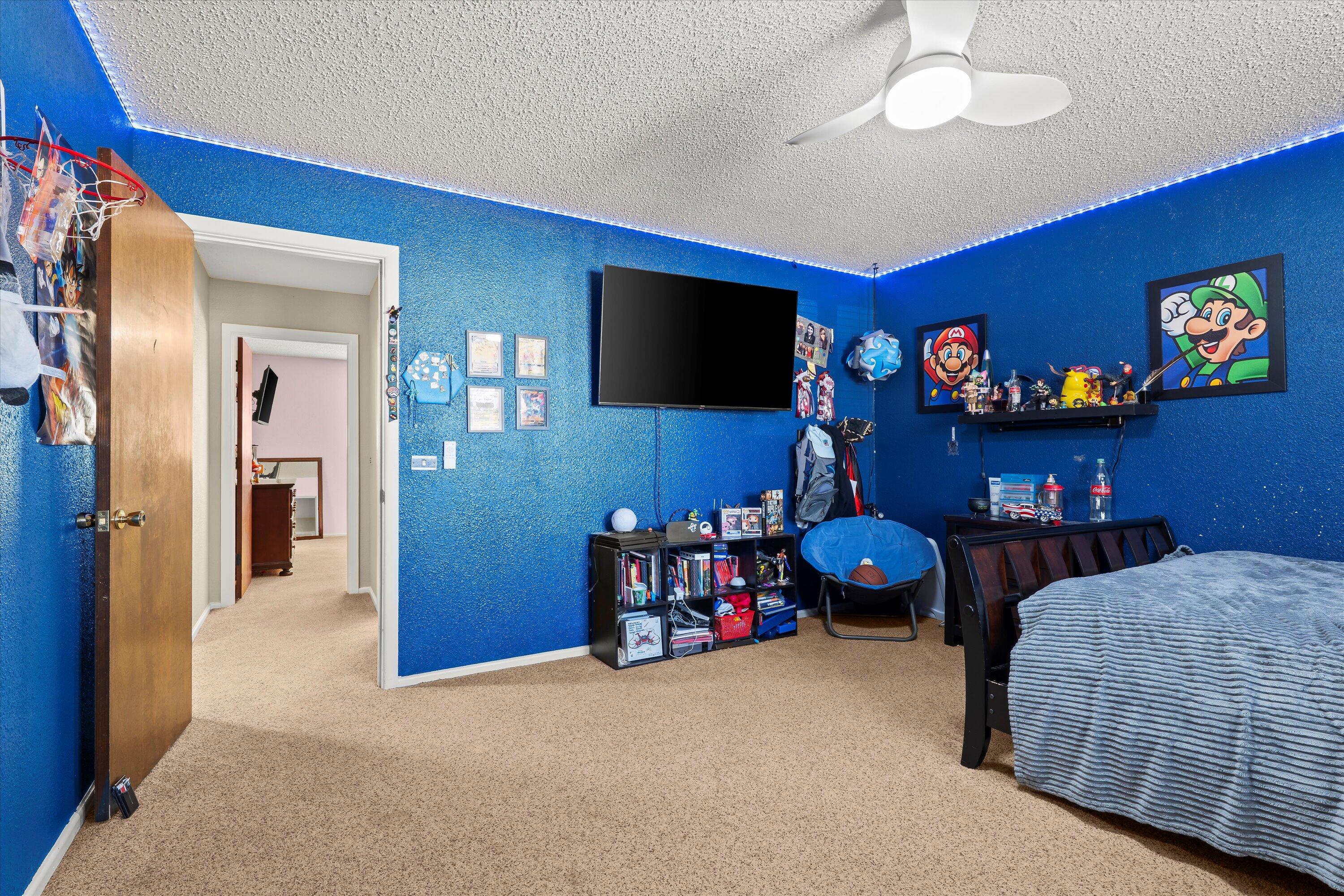 403 Crescent Drive Littlefield, TX 79339 - Photo 23 of 35 a bedroom with two beds and a flat screen tv