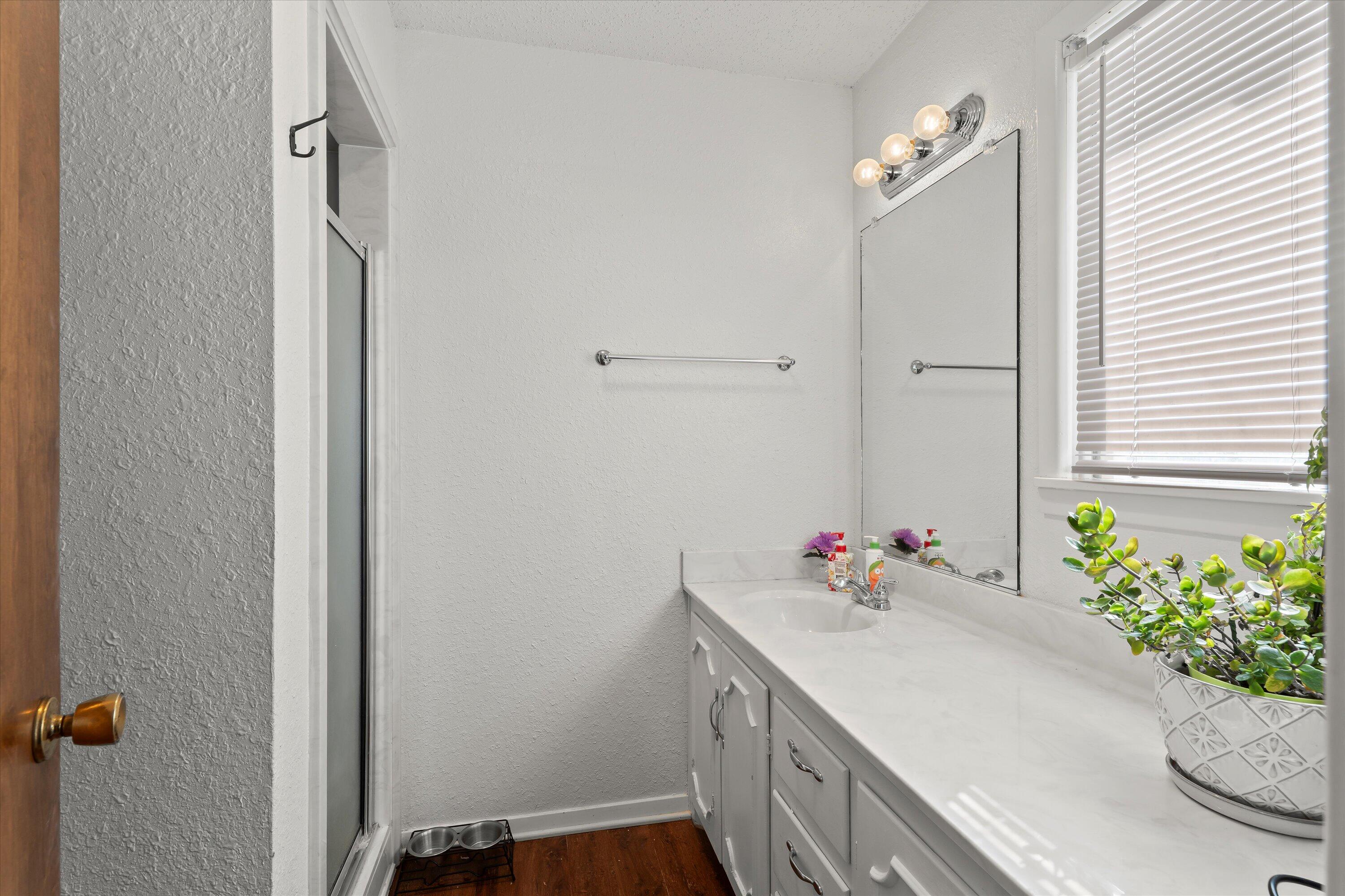 403 Crescent Drive Littlefield, TX 79339 - Photo 27 of 35 a bathroom with a sink vanity and a mirror