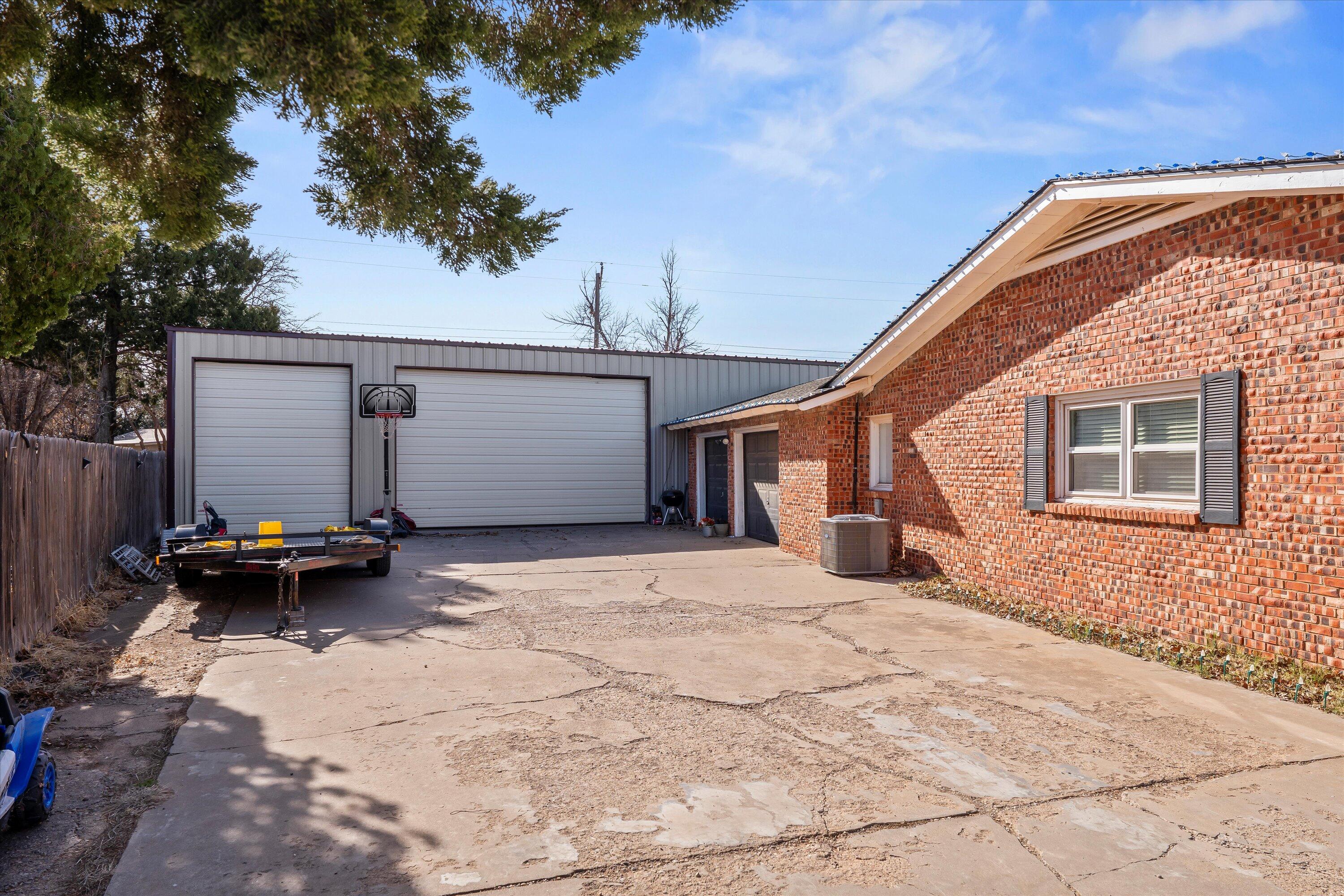 403 Crescent Drive Littlefield, TX 79339 - Photo 3 of 35 a backyard of a house with barbeque oven and bench