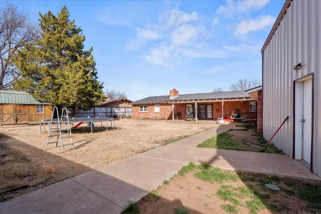 a view of a house with backyard porch and sitting area