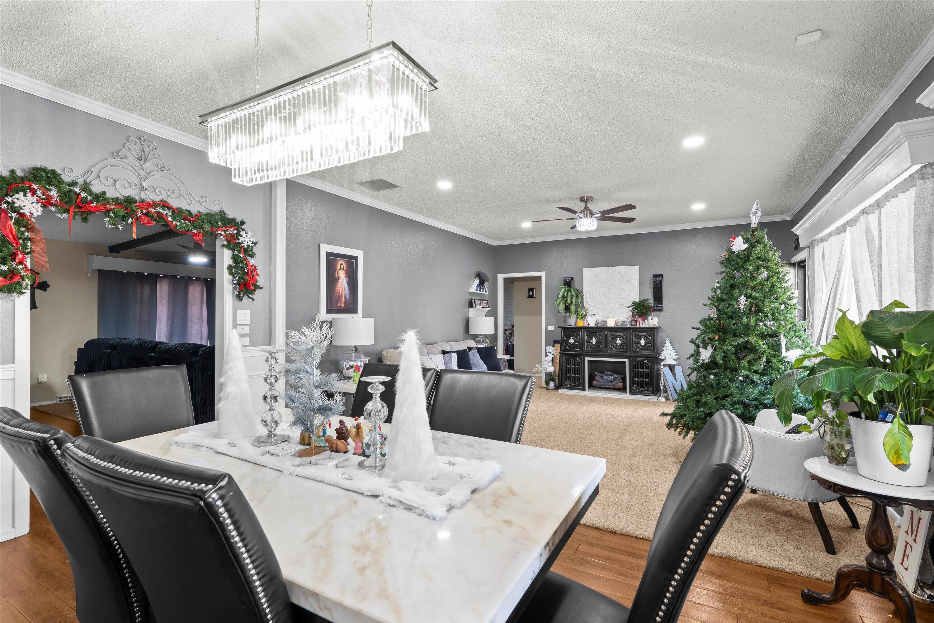 403 Crescent Drive Littlefield, TX 79339 - Photo 8 of 35 a living room with furniture and a chandelier