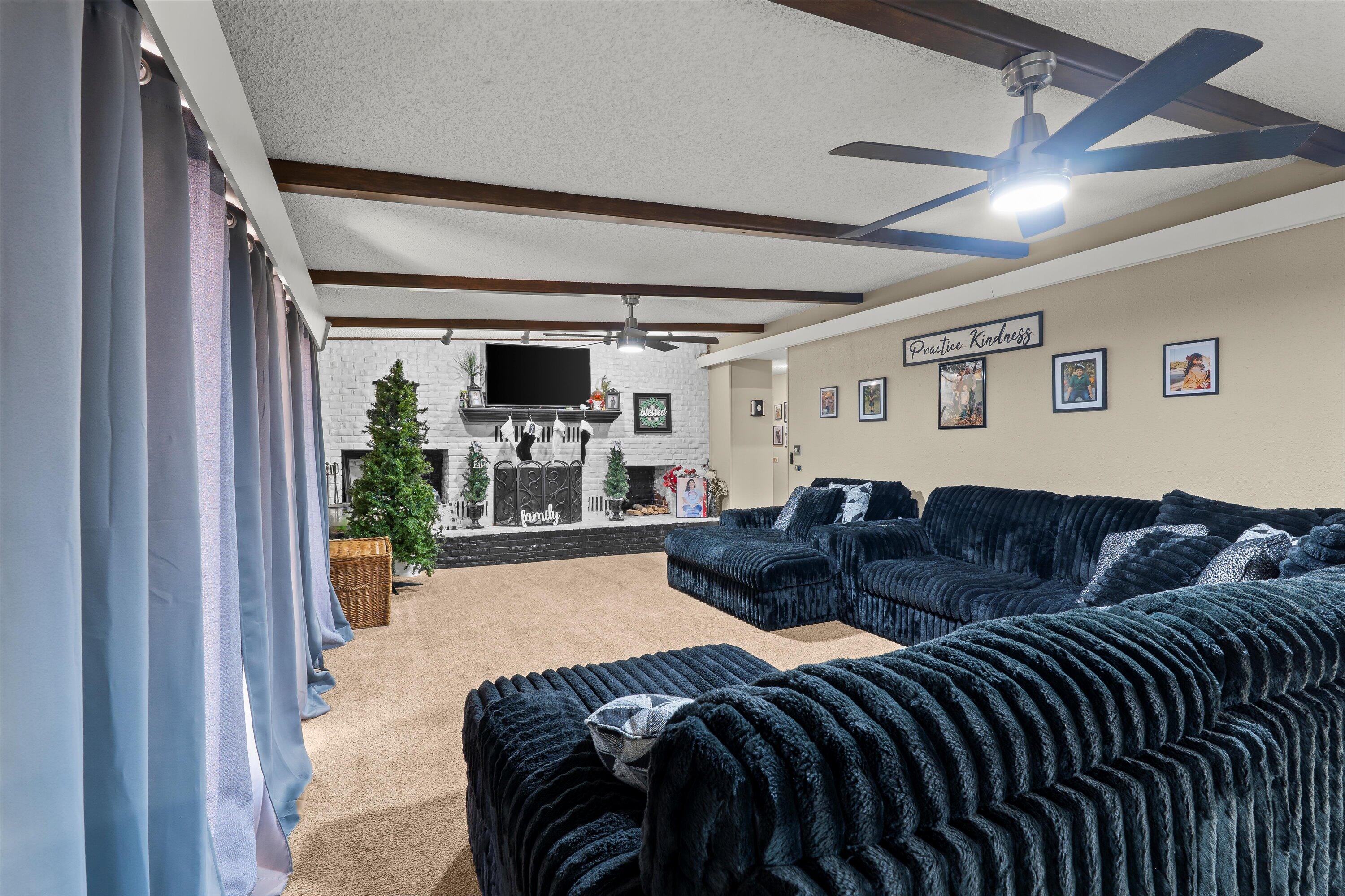 403 Crescent Drive Littlefield, TX 79339 - Photo 10 of 35 a living room with furniture and a large window