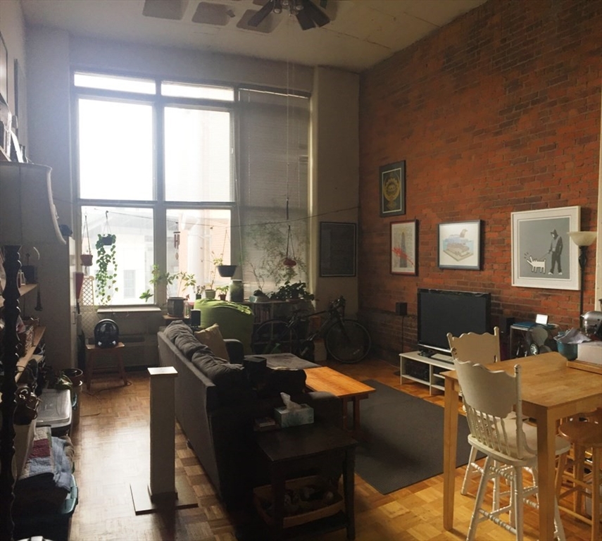 61 Brookline Avenue, Unit 226 Boston, MA 02215 - Photo 2 of 13 a view of a dining room with furniture window and outside view