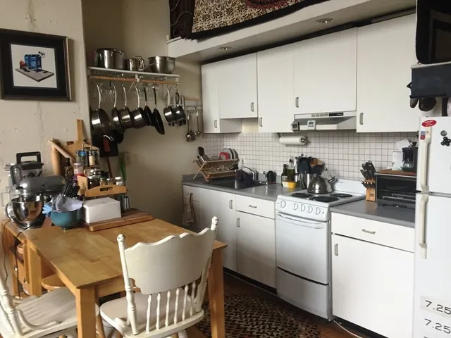 a kitchen with a sink cabinets and appliances