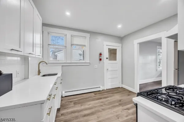 a kitchen with a stove and a refrigerator