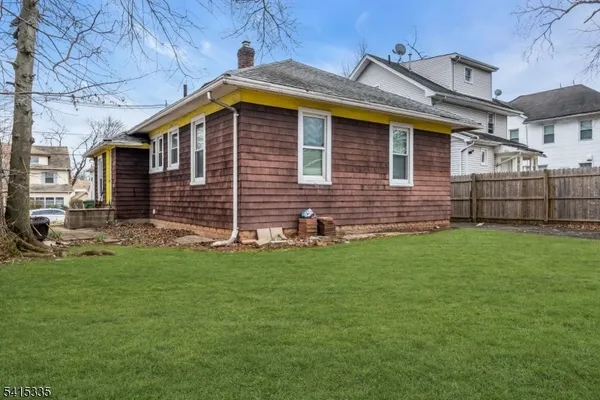 a view of a house with a back yard