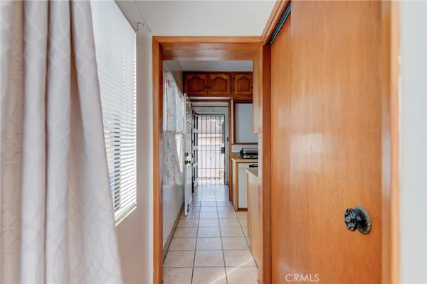 a hallway with sliding door and a yard