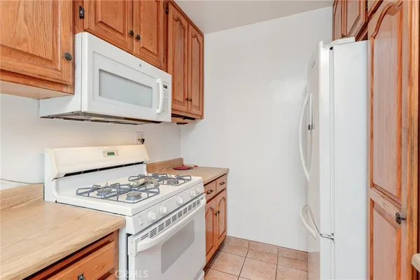 a kitchen with a stove and a microwave