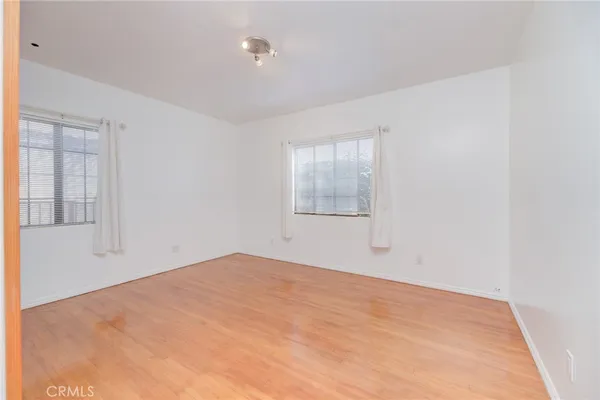 a view of empty room with windows