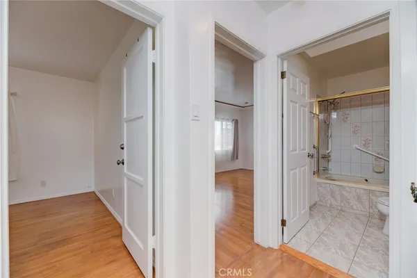 a view of a bathroom with a glass door shower