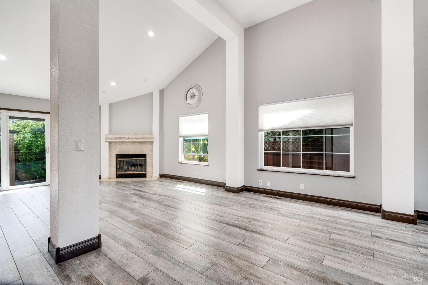 187 Wikiup Meadows Drive Santa Rosa, CA 95403 - Photo 13 of 66 a view of an empty room with wooden floor and a window