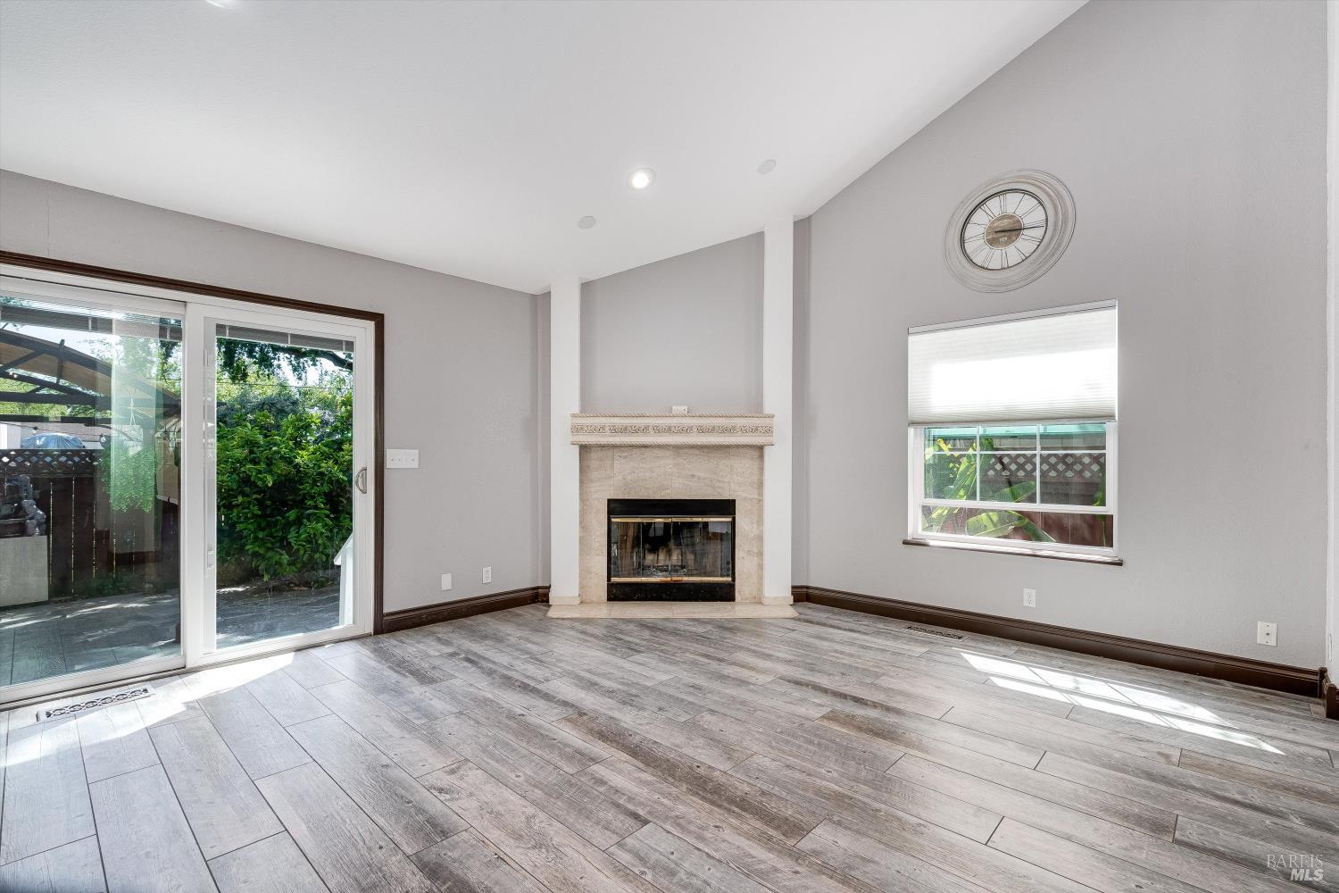 187 Wikiup Meadows Drive Santa Rosa, CA 95403 - Photo 18 of 66 a view of an empty room with a window and fireplace