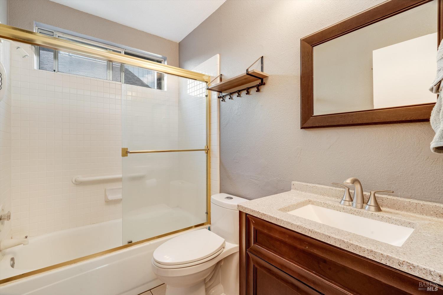 187 Wikiup Meadows Drive Santa Rosa, CA 95403 - Photo 27 of 66 a bathroom with a sink a toilet and a mirror