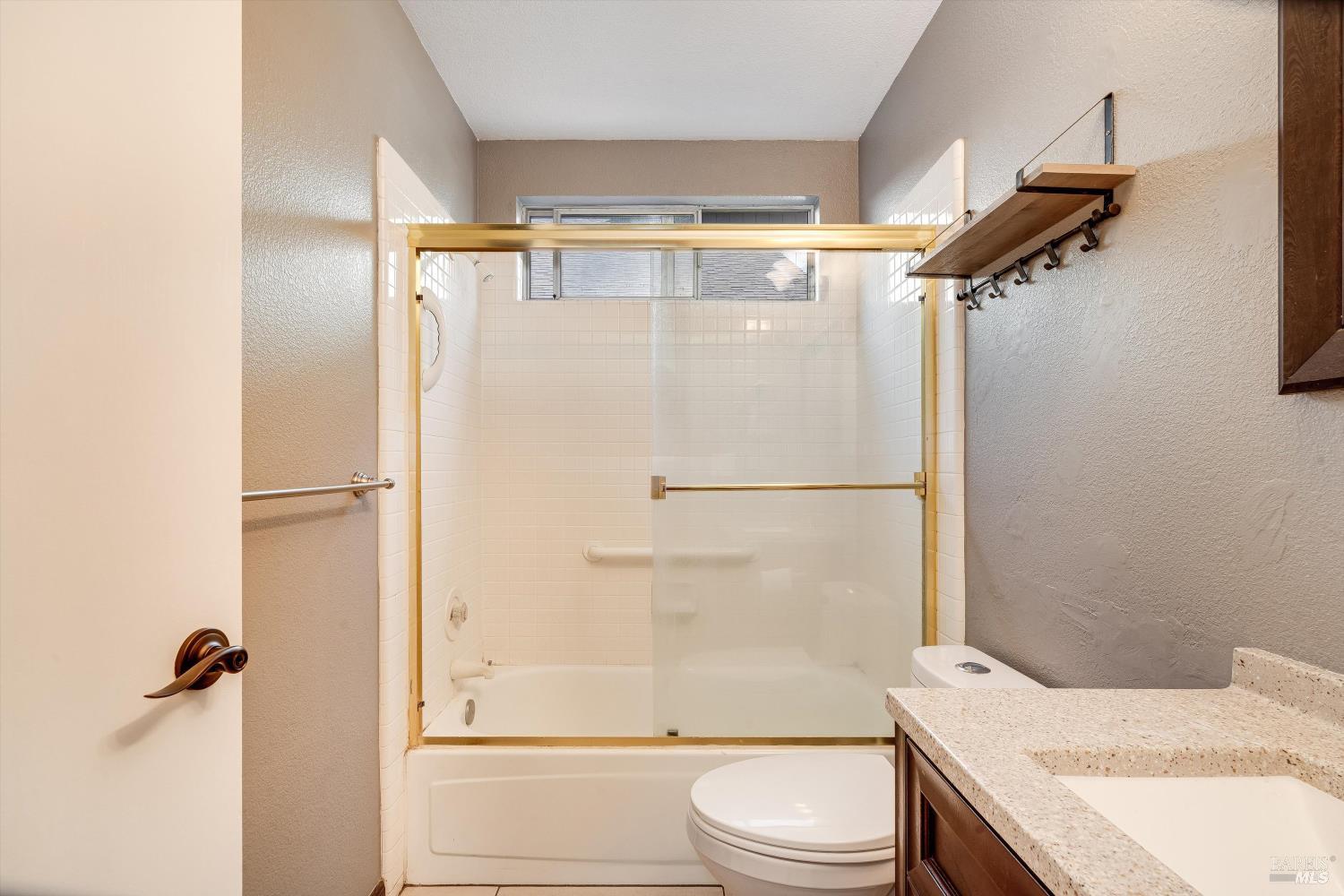187 Wikiup Meadows Drive Santa Rosa, CA 95403 - Photo 28 of 66 a bathroom with a granite countertop shower sink vanity and toilet