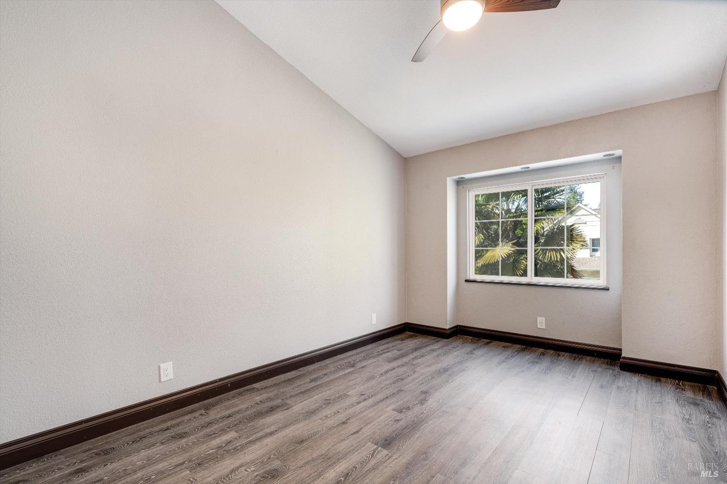 187 Wikiup Meadows Drive Santa Rosa, CA 95403 - Photo 30 of 66 an empty room with wooden floor and windows