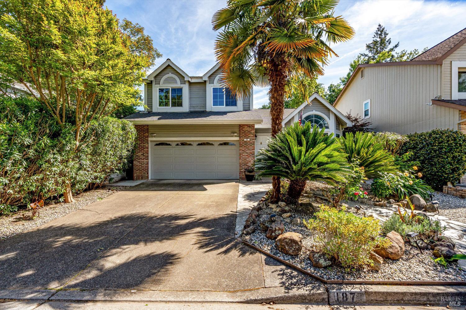 187 Wikiup Meadows Drive Santa Rosa, CA 95403 - Photo 3 of 66 a front view of a house with a yard and garage