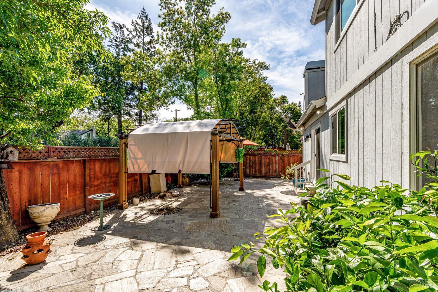 187 Wikiup Meadows Drive Santa Rosa, CA 95403 - Photo 56 of 66 a backyard of a house with barbeque oven and outdoor seating