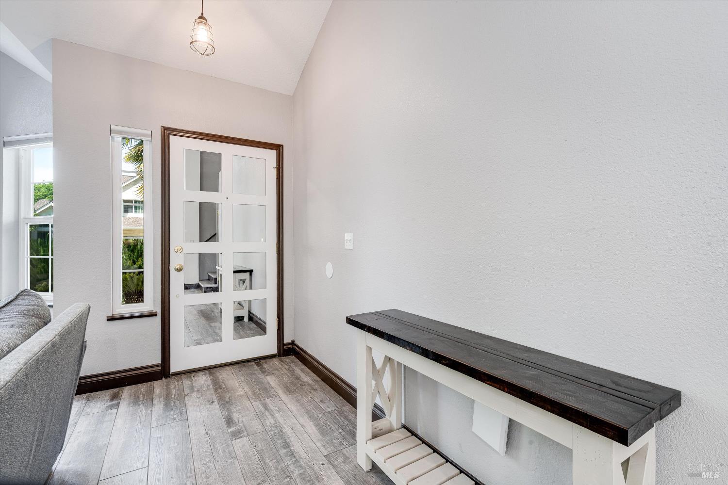 187 Wikiup Meadows Drive Santa Rosa, CA 95403 - Photo 6 of 66 a view of wooden floor and chairs in a room