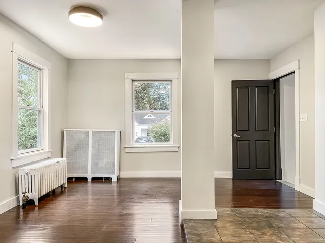 a view of livingroom with furniture window and front door