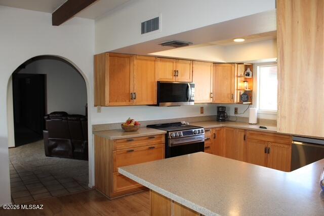 1201 East Old Stewart Road Willcox, AZ 85643 - Photo 6 of 49 a kitchen with stainless steel appliances granite countertop a stove a sink and a microwave