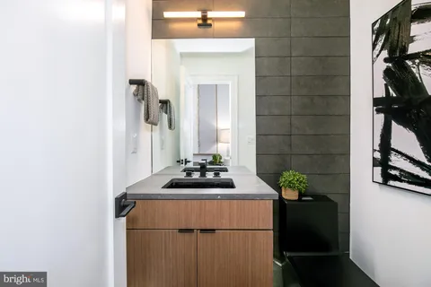 a room with a sink and a mirror