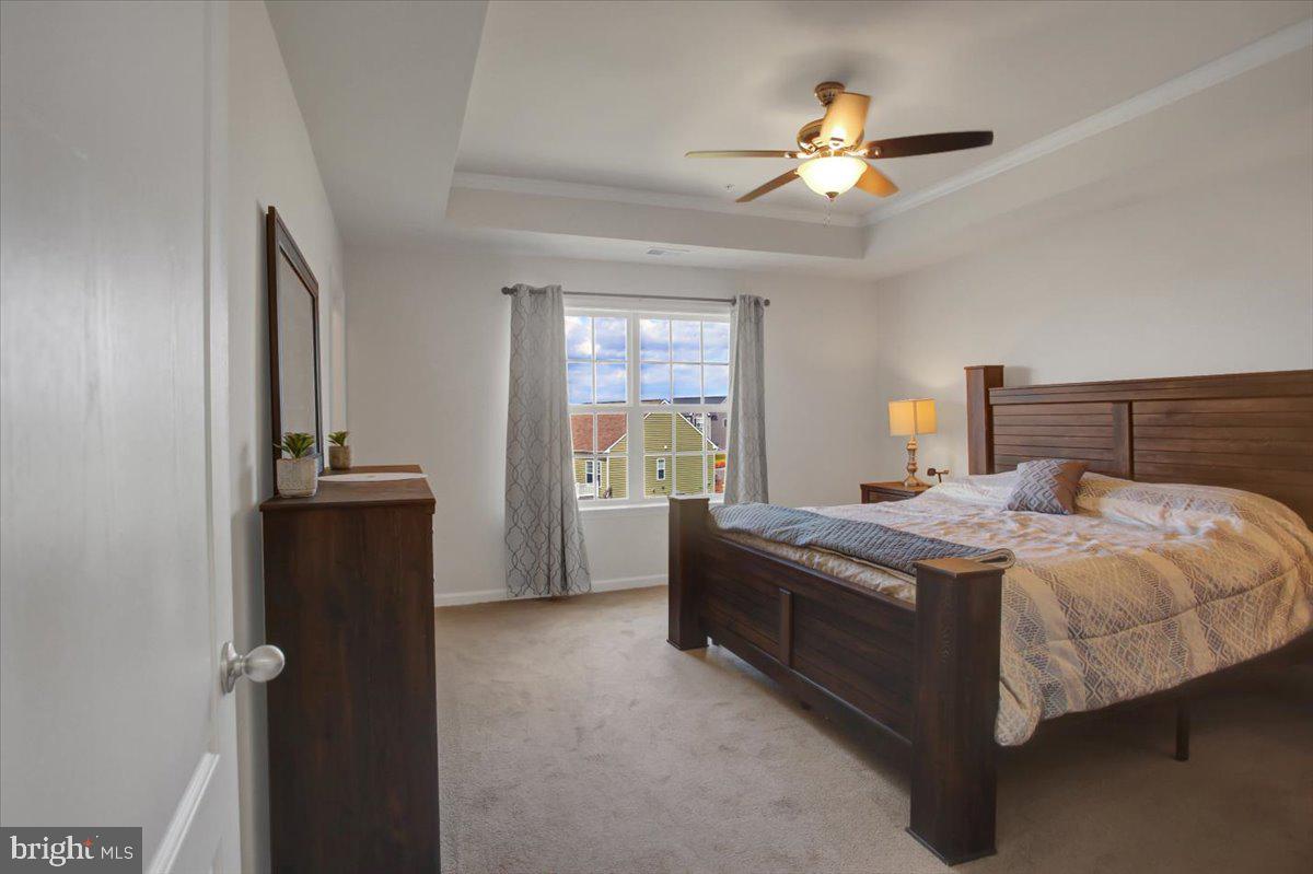 9822 Ripple Drive Williamsport, MD 21795 - Photo 16 of 41 a bedroom with a bed and a chandelier