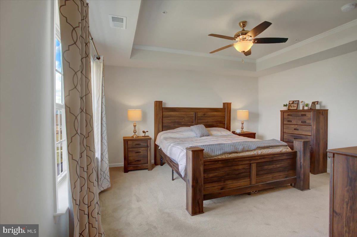 9822 Ripple Drive Williamsport, MD 21795 - Photo 18 of 41 a bedroom with a bed and a chandelier