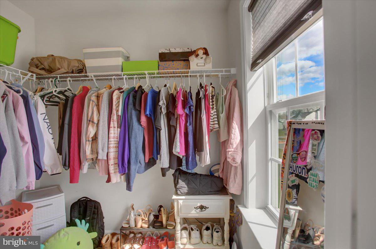 9822 Ripple Drive Williamsport, MD 21795 - Photo 23 of 41 a view of walk in closet with clothes