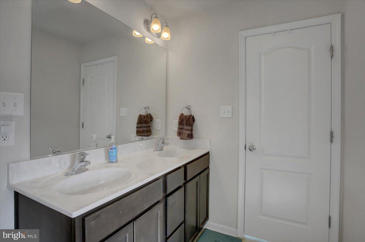 9822 Ripple Drive Williamsport, MD 21795 - Photo 26 of 41 a bathroom with a sink and a mirror