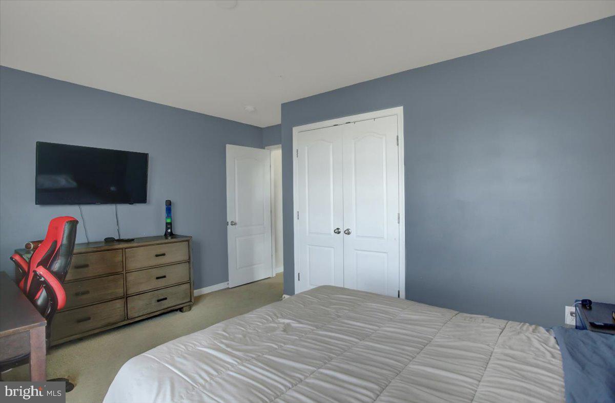 9822 Ripple Drive Williamsport, MD 21795 - Photo 32 of 41 a bedroom with a bed and flat screen tv