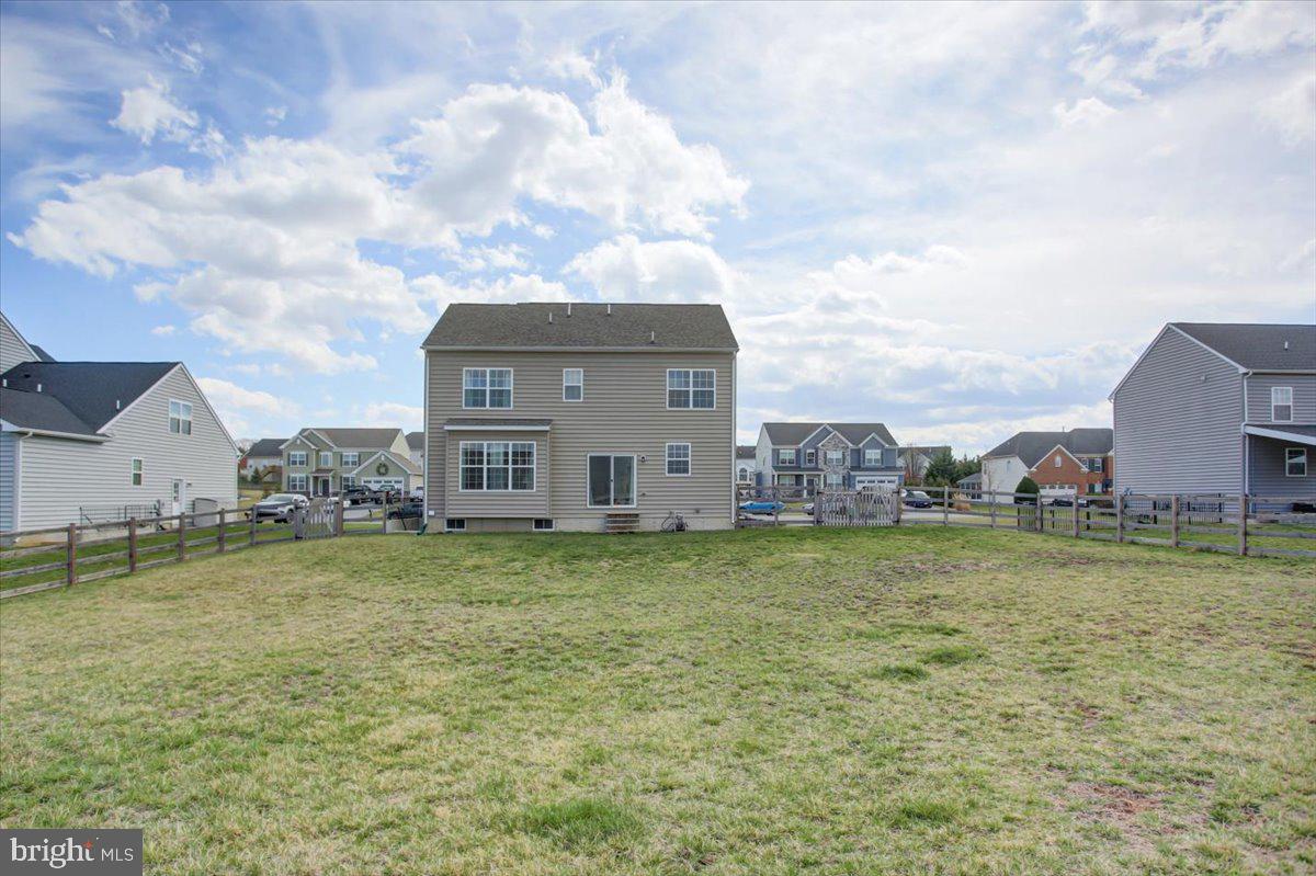 9822 Ripple Drive Williamsport, MD 21795 - Photo 40 of 41 a house with huge green field in front of it