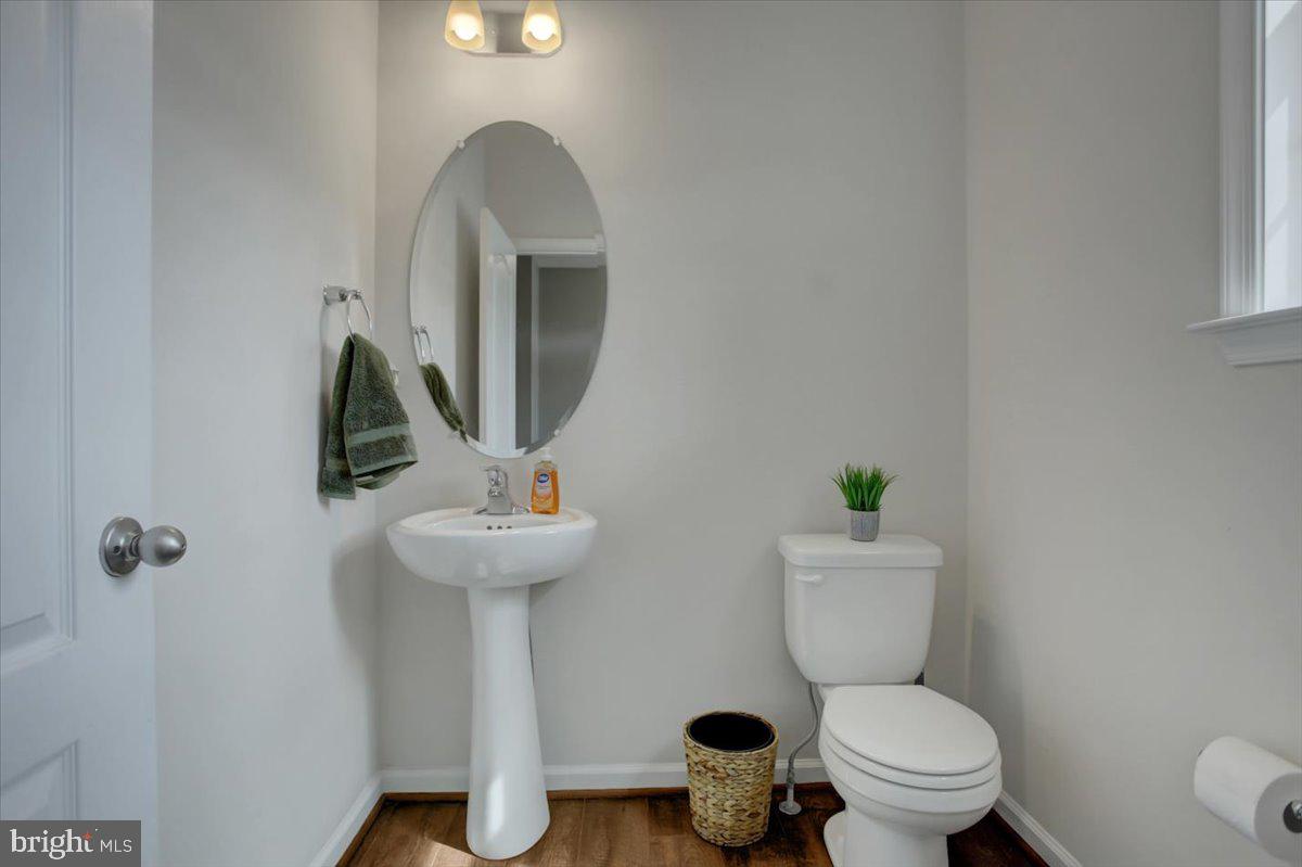 9822 Ripple Drive Williamsport, MD 21795 - Photo 7 of 41 a bathroom with a toilet sink and mirror