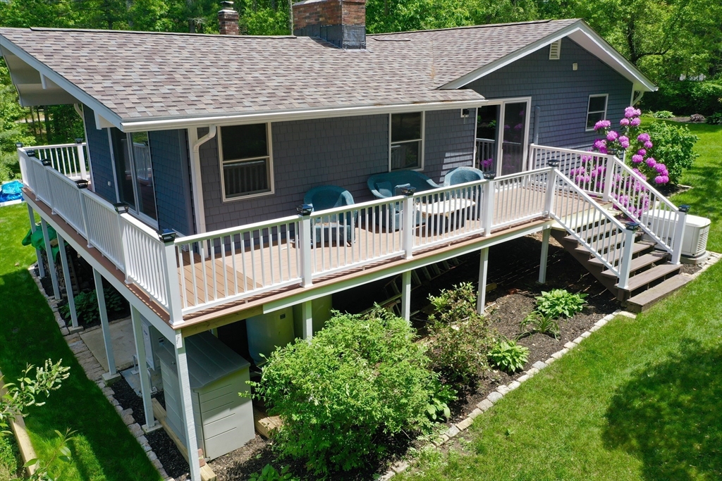 a front view of house with balcony and garden