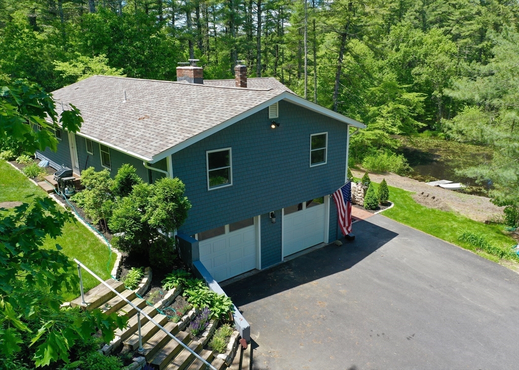 7 Brook Street Plympton, MA 02367 - Photo 28 of 42 a aerial view of a house with a yard and large trees