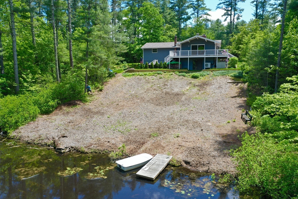 7 Brook Street Plympton, MA 02367 - Photo 3 of 42 a view of a wooden house with a yard