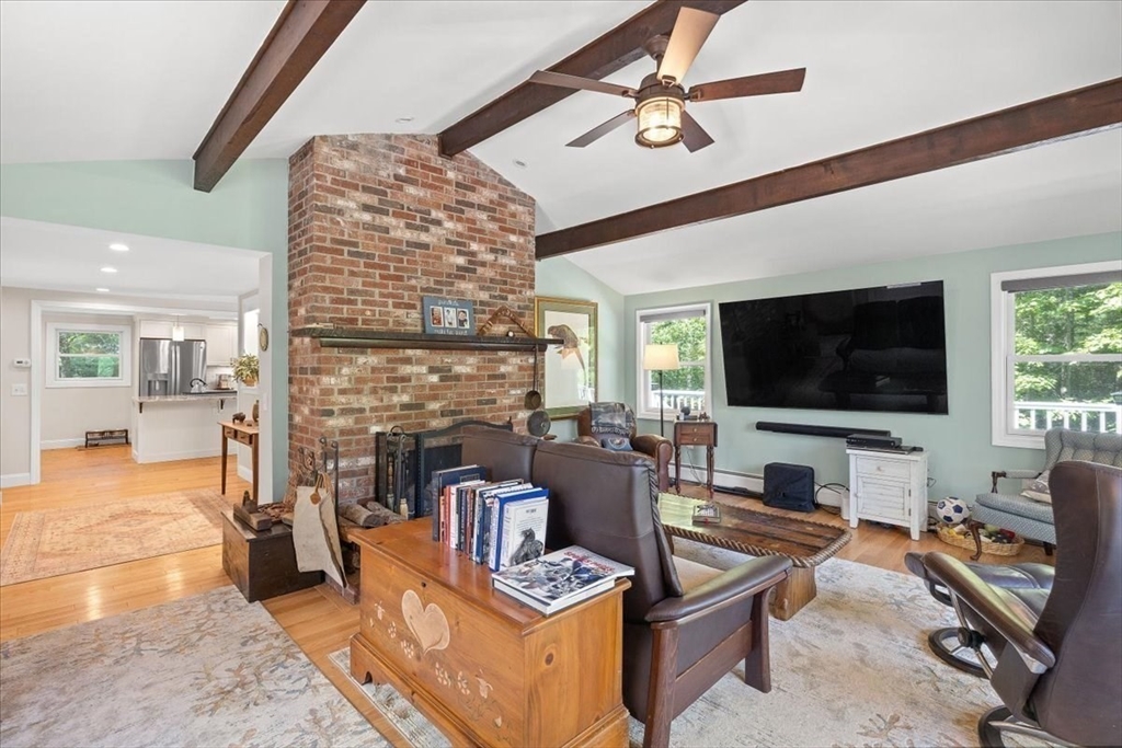 7 Brook Street Plympton, MA 02367 - Photo 4 of 42 a living room with furniture a flat screen tv and a fireplace