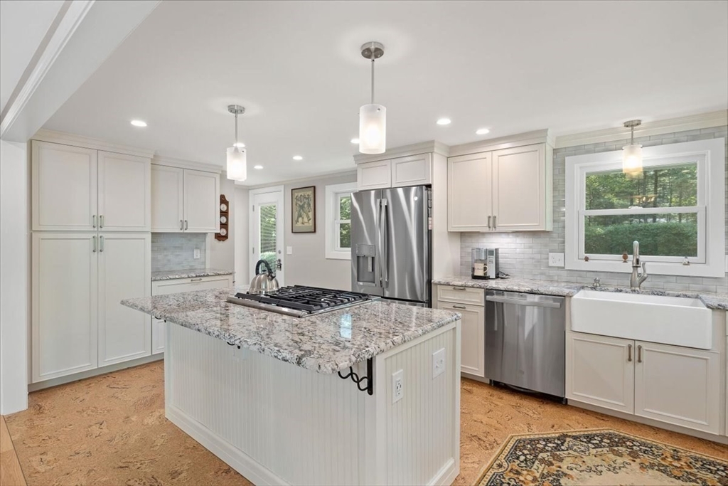 7 Brook Street Plympton, MA 02367 - Photo 7 of 42 a kitchen with stainless steel appliances granite countertop a sink stove and refrigerator