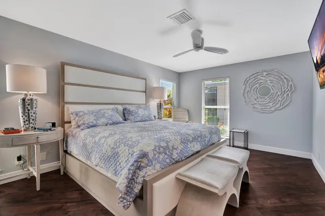 a view of a kitchen with white cabinets