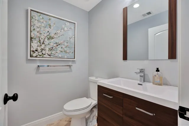 a view of a dining room with furniture wooden floor and a chandelier