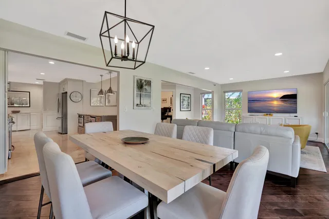 a living room with fireplace furniture and a flat screen tv