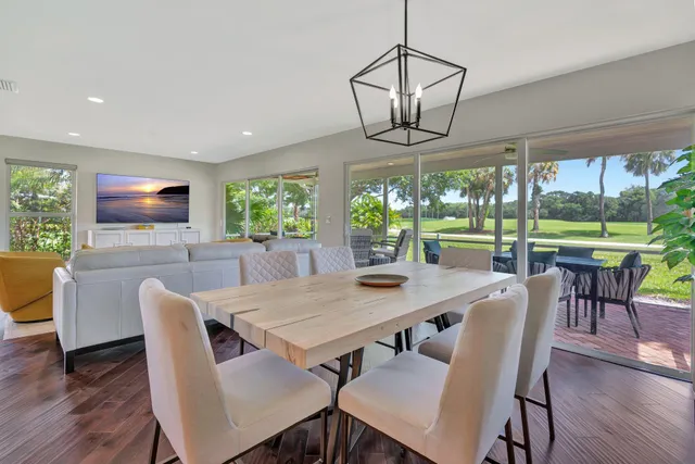 a large kitchen with stainless steel appliances granite countertop a stove and a sink