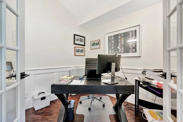 an aerial view of residential houses with outdoor space and lake view