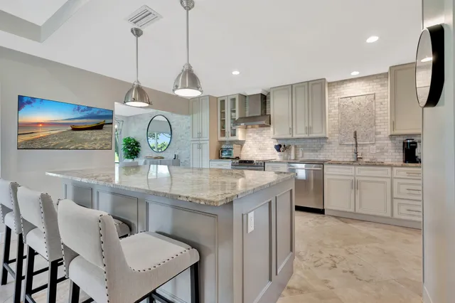 a view of a house with backyard and a tree
