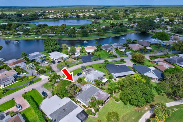 a living room with patio bathtub and wooden floor