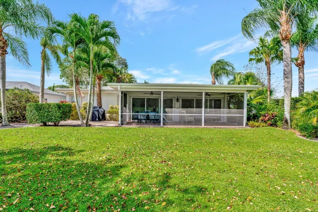 a view of swimming pool with outdoor seating and lake view