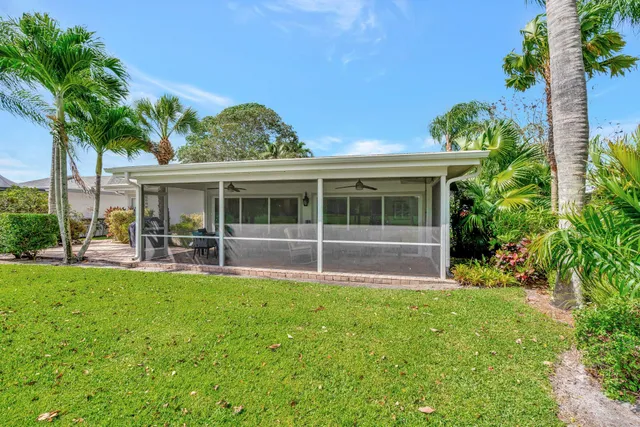a view of swimming pool with a table and chairs