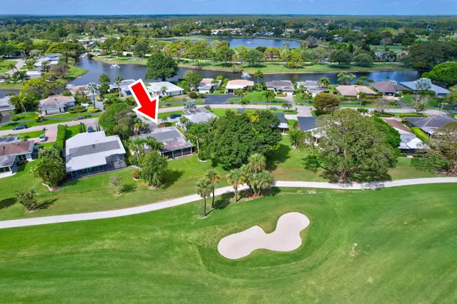 a bedroom with bed and wooden floor