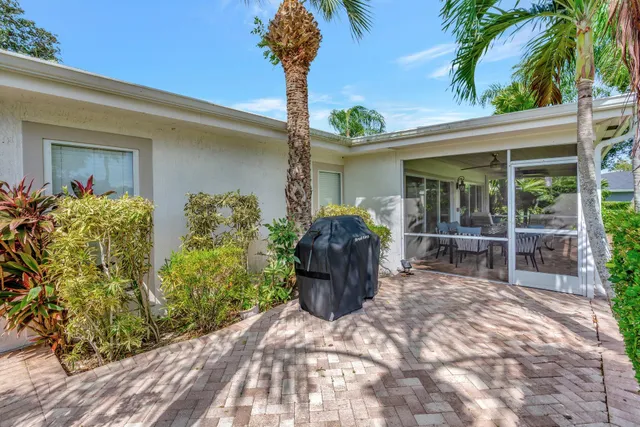 a bathroom with a sink mirror vanity and toilet